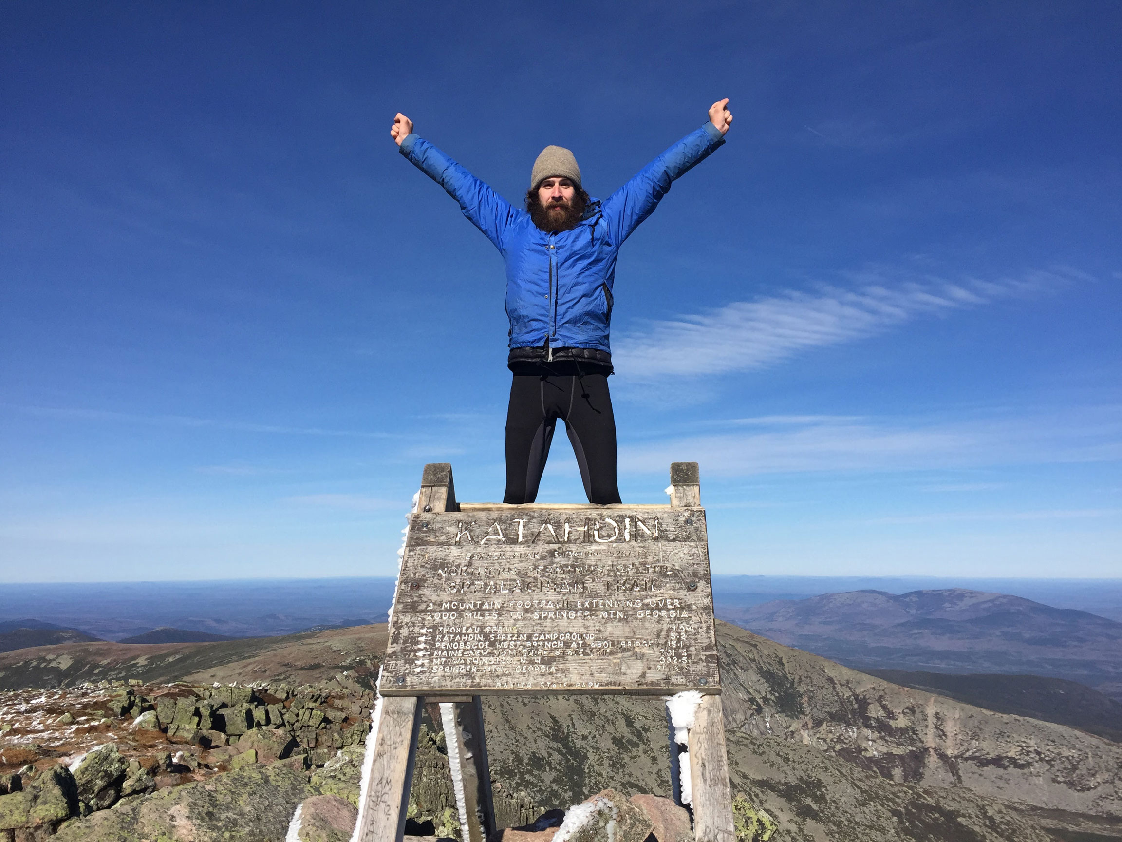 Northbound thru-hiker summiting Katahdin